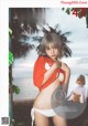 A magazine with a picture of a woman in a bikini.